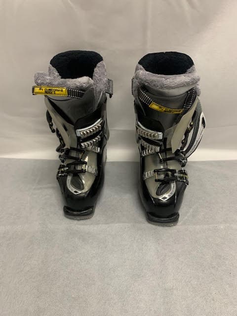 A pair of ski boots with fur on them.