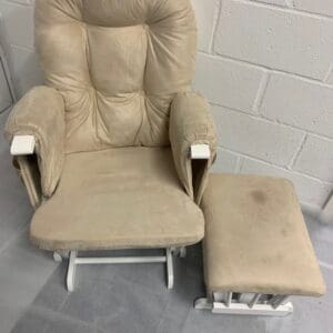 Beige rocking chair with ottoman.