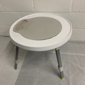 White round activity table with tray.