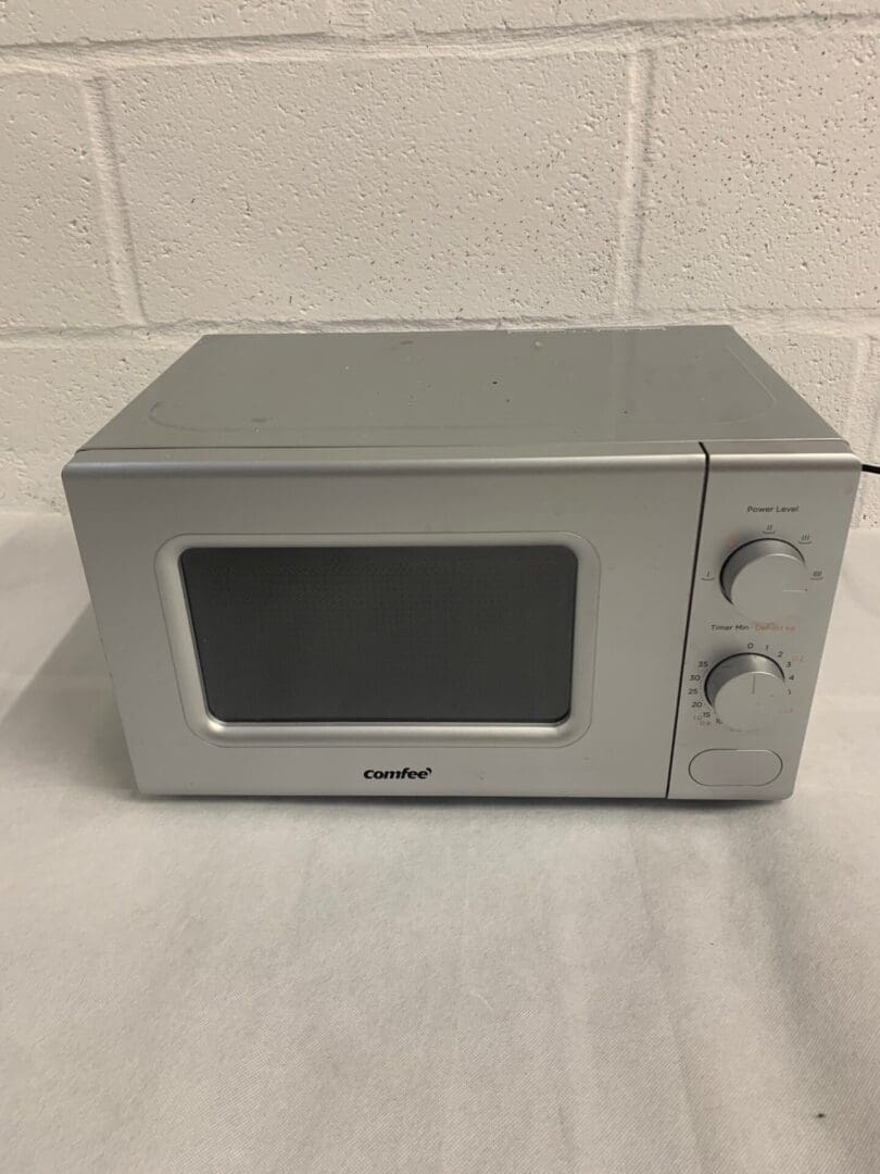 Silver Comfee microwave oven.