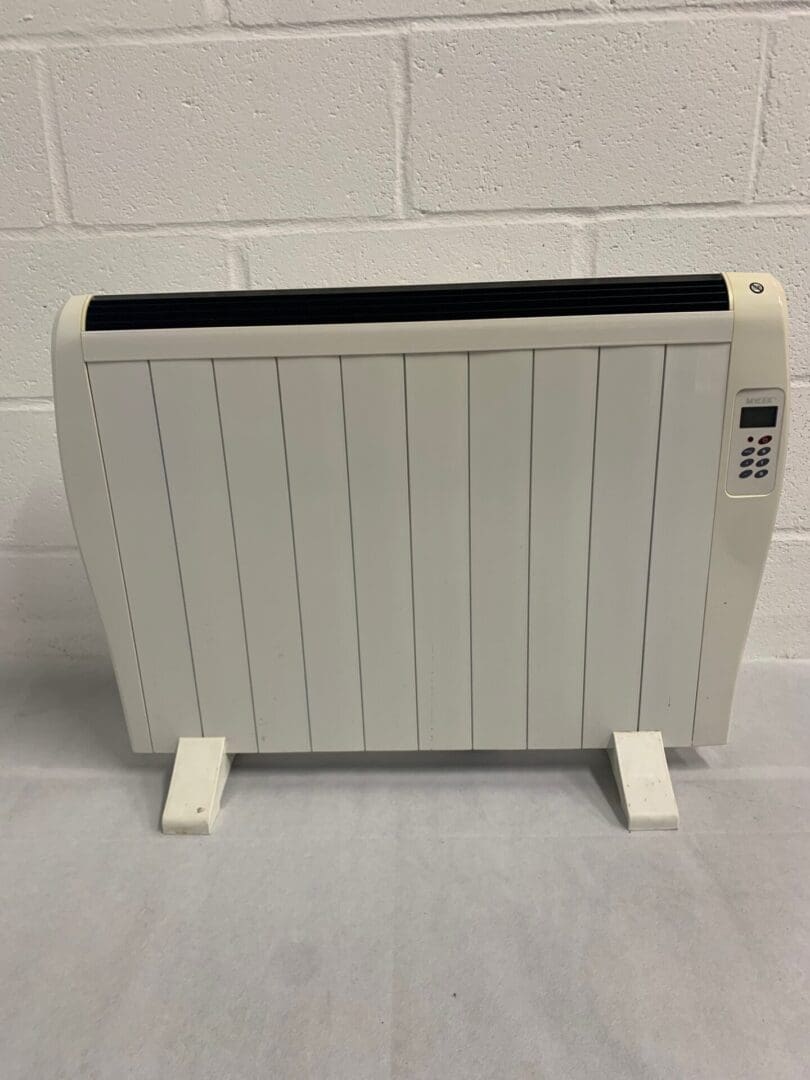 White electric panel heater with control panel.