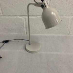 Light gray adjustable desk lamp.